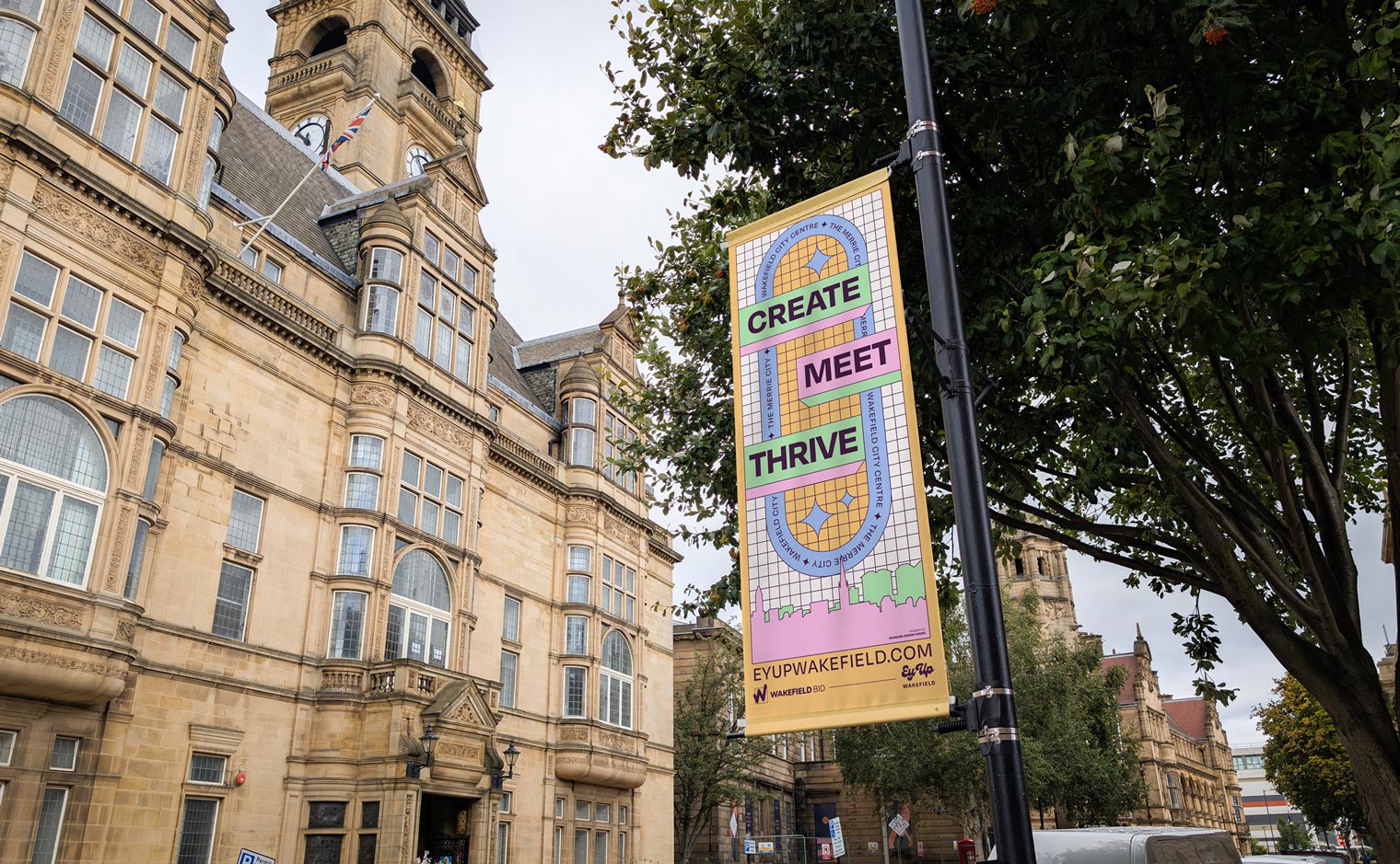 'Ey Up Wakefield' City Centre Lamppost Flag Banners for Wakefield BID - View of Wood Street and Town Hall