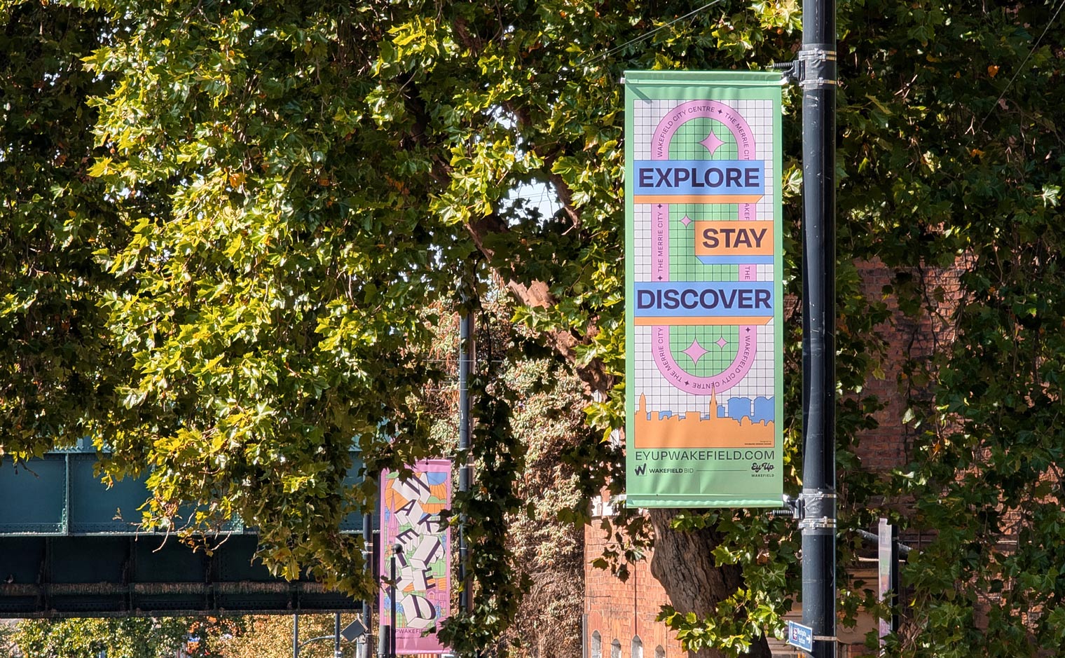 'Ey Up Wakefield' City Centre Lamppost Flag Banners for Wakefield BID - View of Westgate